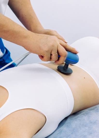 A,Female,Physiotherapist,Applies,Diathermy,Treatment,To,A,Patient’s,Back, A,Female,Physiotherapist,Applies,Diathermy,Treatment,To,A,Patient's,Back,