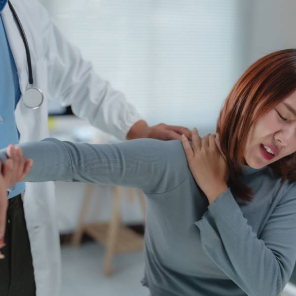 Female,Patient,Experiencing,Shoulder,Pain,During,A,Physical,Examination,Conducted Female,Patient,Experiencing,Shoulder,Pain,During,A,Physical,Examination,Conducted